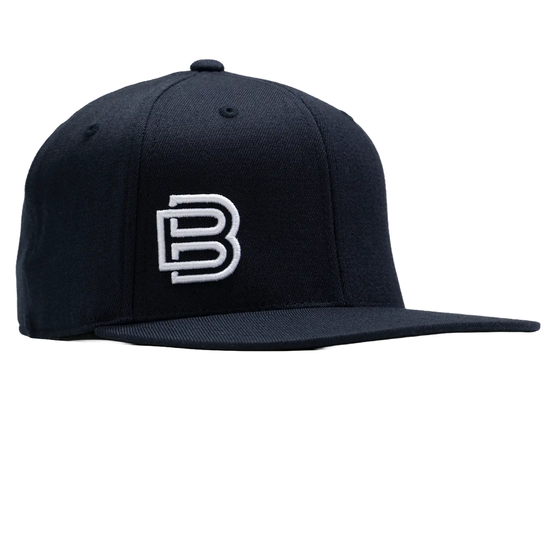 Baseline Boss Bandit navy pickleball hat at 45-degree angle. Snapback cap with curved brim and embroidered logo.